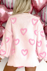 Pull ample à manches bouffantes en forme de cœur rose